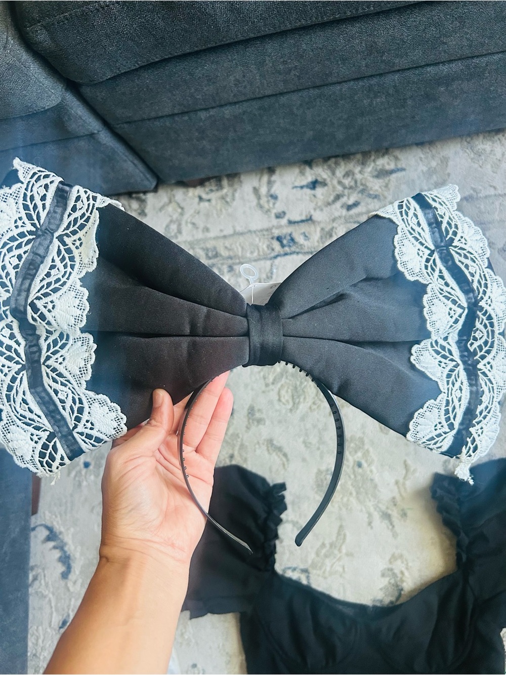 large black fabric bow headband trimmed with white lace